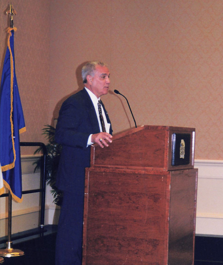 Figure 1. Col Larry Fontenelle, Past President/ Historian, Presenting at Annual Meeting 2001.