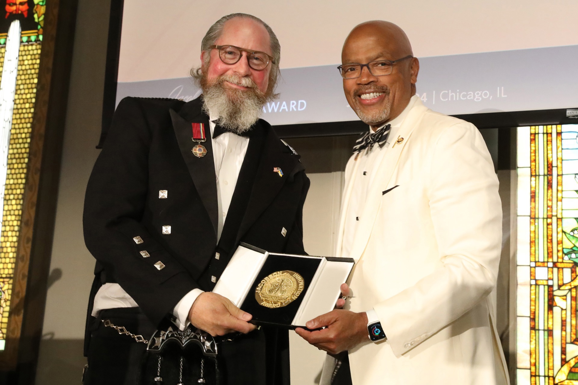 Robert A. Montgomery, MD, DPhil, FACS (left), was presented with the 2024 ACS Jacobson Innovation Award by ACS President Henri R. Ford, MD, MHA, FACS, FRCS (right). Photo credit: American College of Surgeons