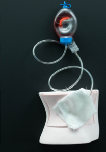 Place a second gauze over the drain.